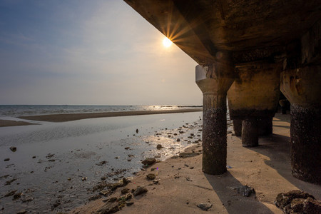 Under the walkway of Bangsaen Beach in the evening time  very fe