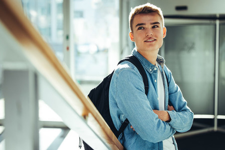 Young man standing in university