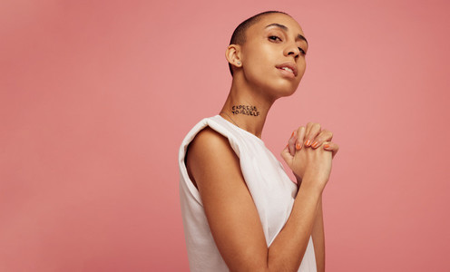 Confident woman with express yourself written on her neck