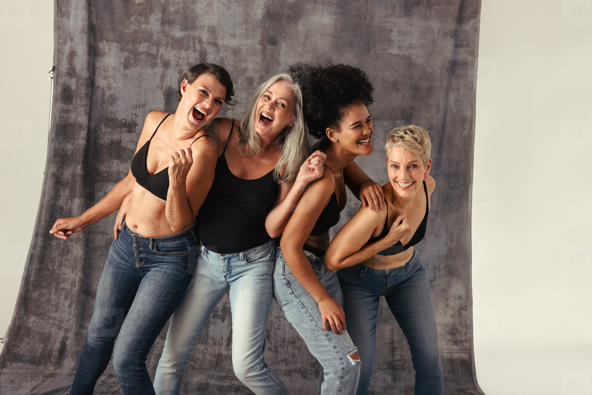 Women of different ages having fun in jeans