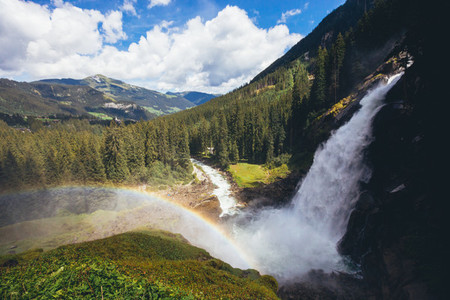 beautiful waterfall in the alpine mountains