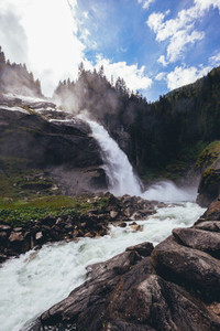 beautiful waterfall in the alpine mountains
