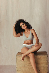 African American model posing confidently in her natural body