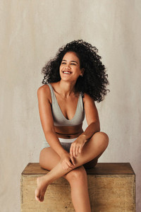 Black female model feeling happy in her natural body