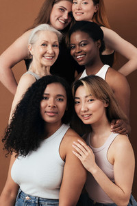 Portrait of six women of different ages looking at camera in studio