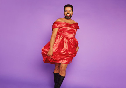Queer person tanding in female dress