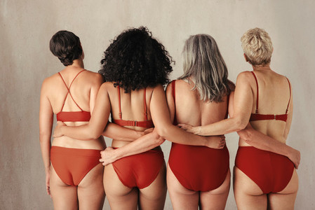 Shot of four anonymous women embracing their natural bodies