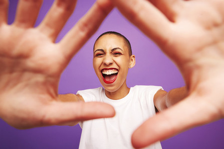 Portrait of excited woman with hands in front