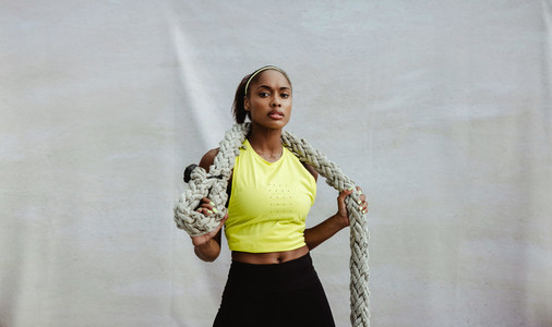 African sportswoman with battle rope