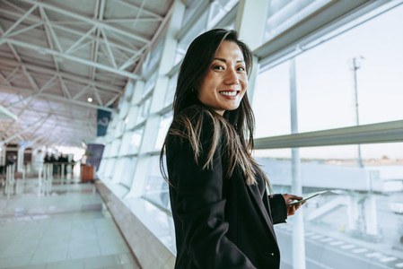 Happy woman in airport