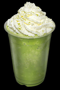 Green Tea Smoothies mixed with whip cream topping on top isolate
