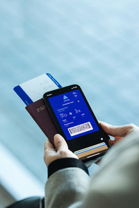 Passenger holding digital pass