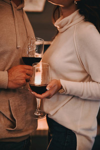 Anonymous couple with wineglasses