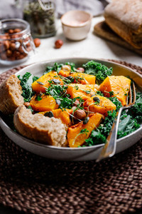 Season salad with grilled pumpkin  kale  chickpea  pepitas and nuts  Autumn vegetarian healthy recipe