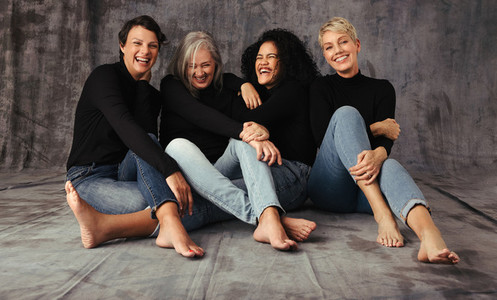 Fashionable women of different ages laughing together