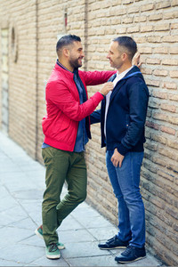 Gay couple in a romantic moment on the street