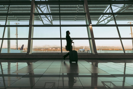 Silhouette of lady in airport