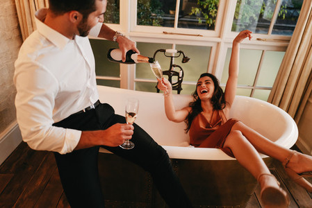 Couple celebrating with sparkling wine