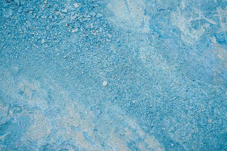 Abstract texture of cracked blue paint