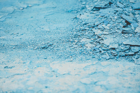 Abstract texture of cracked blue paint