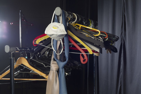Face mask neckties and hangers on rack