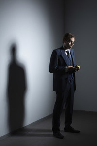 Businessman in suit using smart phone