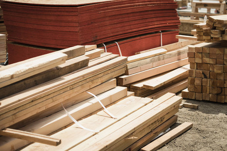 Stacks of wood boards and plywood