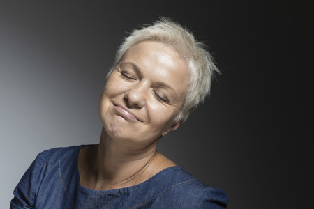 Portrait carefree mature woman with eyes closed