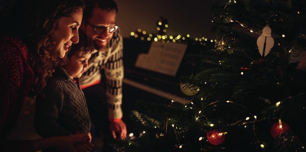 Family looking at Christmas tree