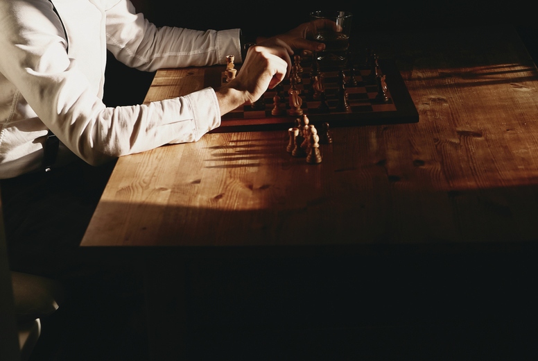 Dapper man playing chess 4