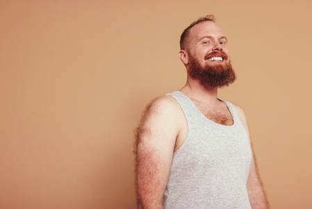 Man with a ginger beard smiling at the camera