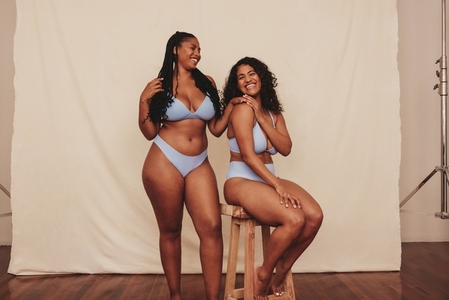 Happy young women feeling comfortable in their natural bodies