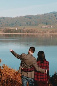 Couple standing by a lake 1