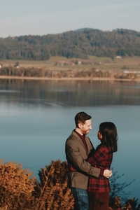 Couple standing by a lake 4