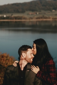 Couple standing by a lake 6