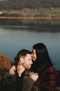Couple standing by a lake 7