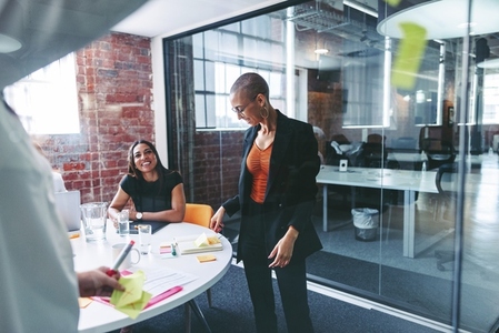 Businesswomen sharing their ideas in a modern office