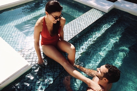 Young couple in a swimming pool together