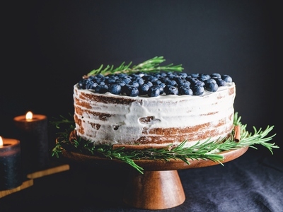 New Year chocolate cake with white cream and fresh blueberries