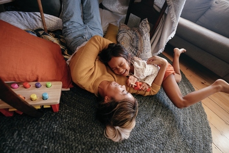 High angle view of a mother and her daughter laughing happily