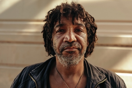Closeup of a homeless man looking at the camera