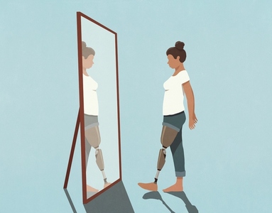Woman with prosthetic leg looking in mirror