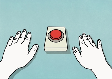 Hands poised at red button