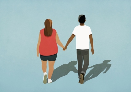 Couple holding hands walking