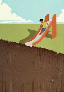 Boy on playground slide at edge of cliff