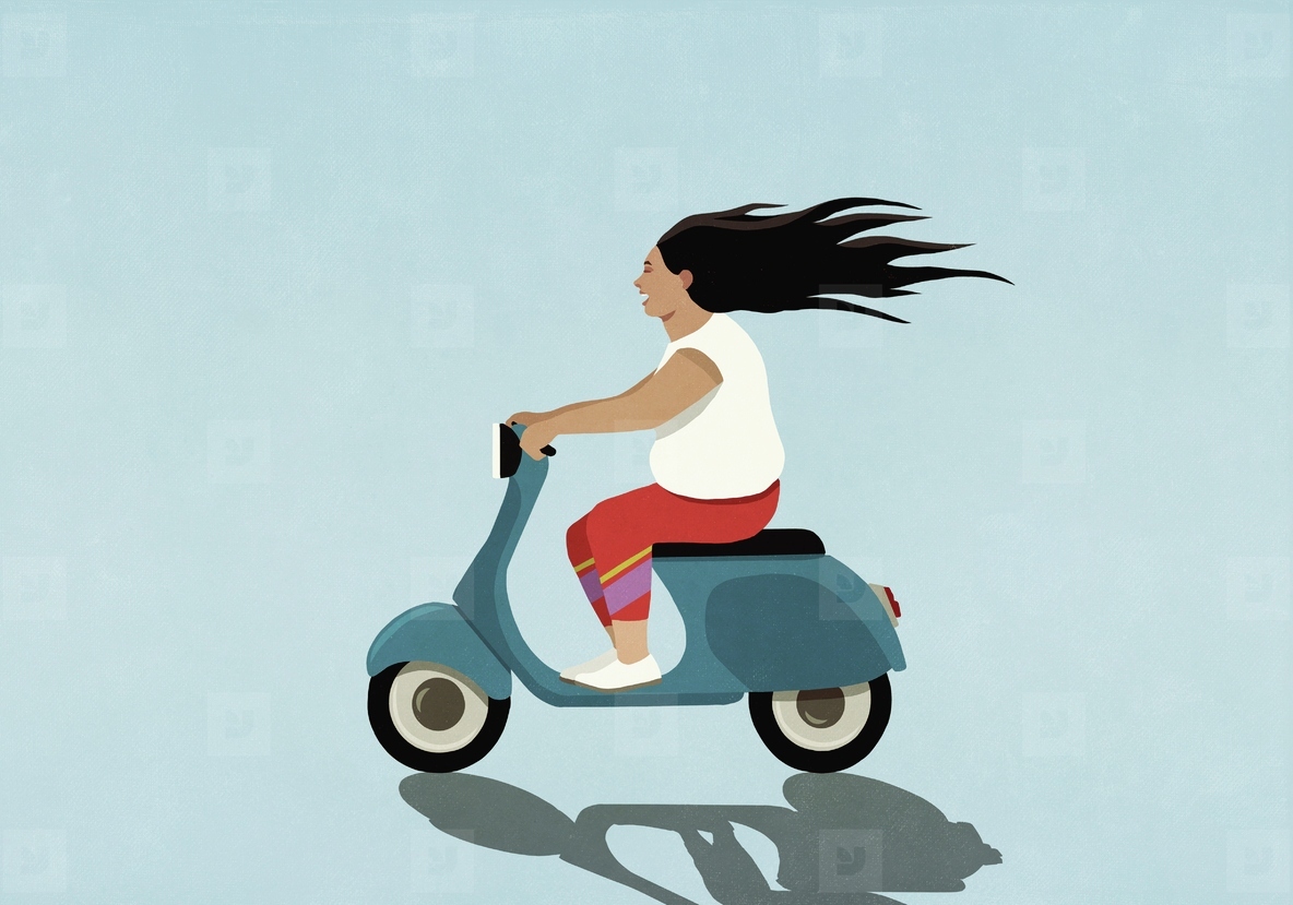Carefree woman driving motor scooter