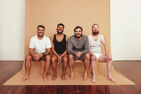 Studio shot of a group of men sitting together