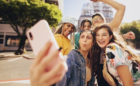 Vibrant young people taking a selfie together