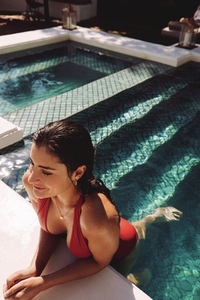 Cheerful young woman relaxing in a swimming pool