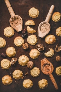 Flat lay of Turkish traditional Hatay semolina cookies with walnut filling
